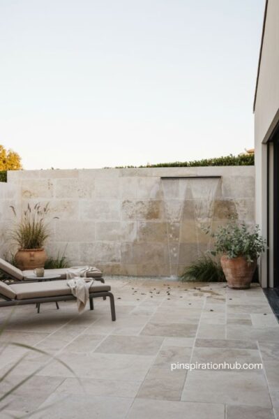 Modern water feature paver patio ideas for a calming outdoor retreat