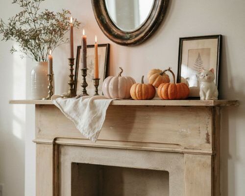 Pink Halloween decor ideas with soft orange mantel accents