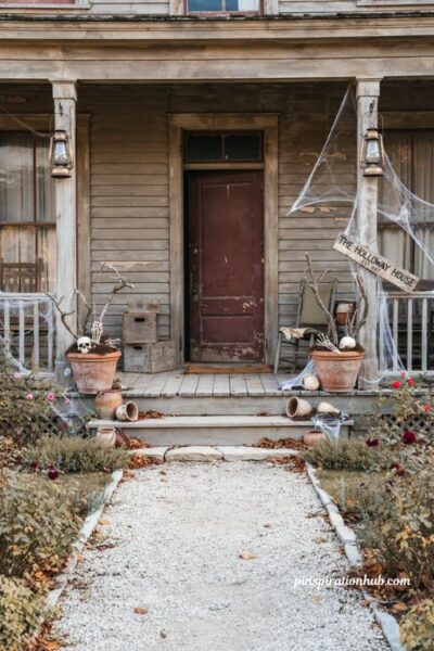 creepy halloween decorations with an abandoned porch spiderwebs crates and skulls
